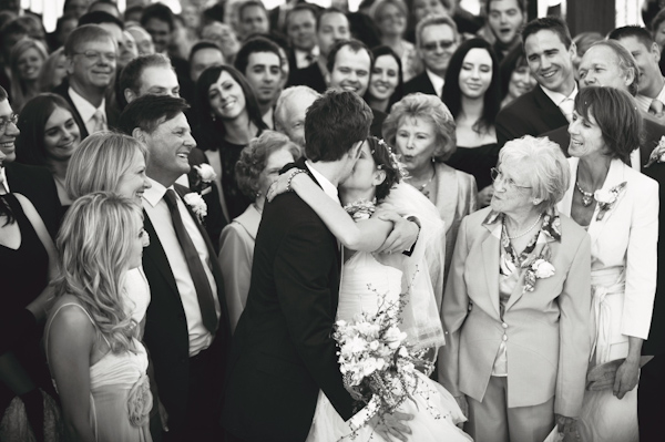 hilarious photo of guests encouraging the kiss - wedding photo by Australia based wedding photographer Natasha Du Preez